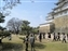 Large courtyard below the castle and lines of people waiting