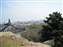 View over the lower rooftops to the modern city below