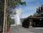 Old Faithful Geyser Erupting from Old Faithful Inn Entrance